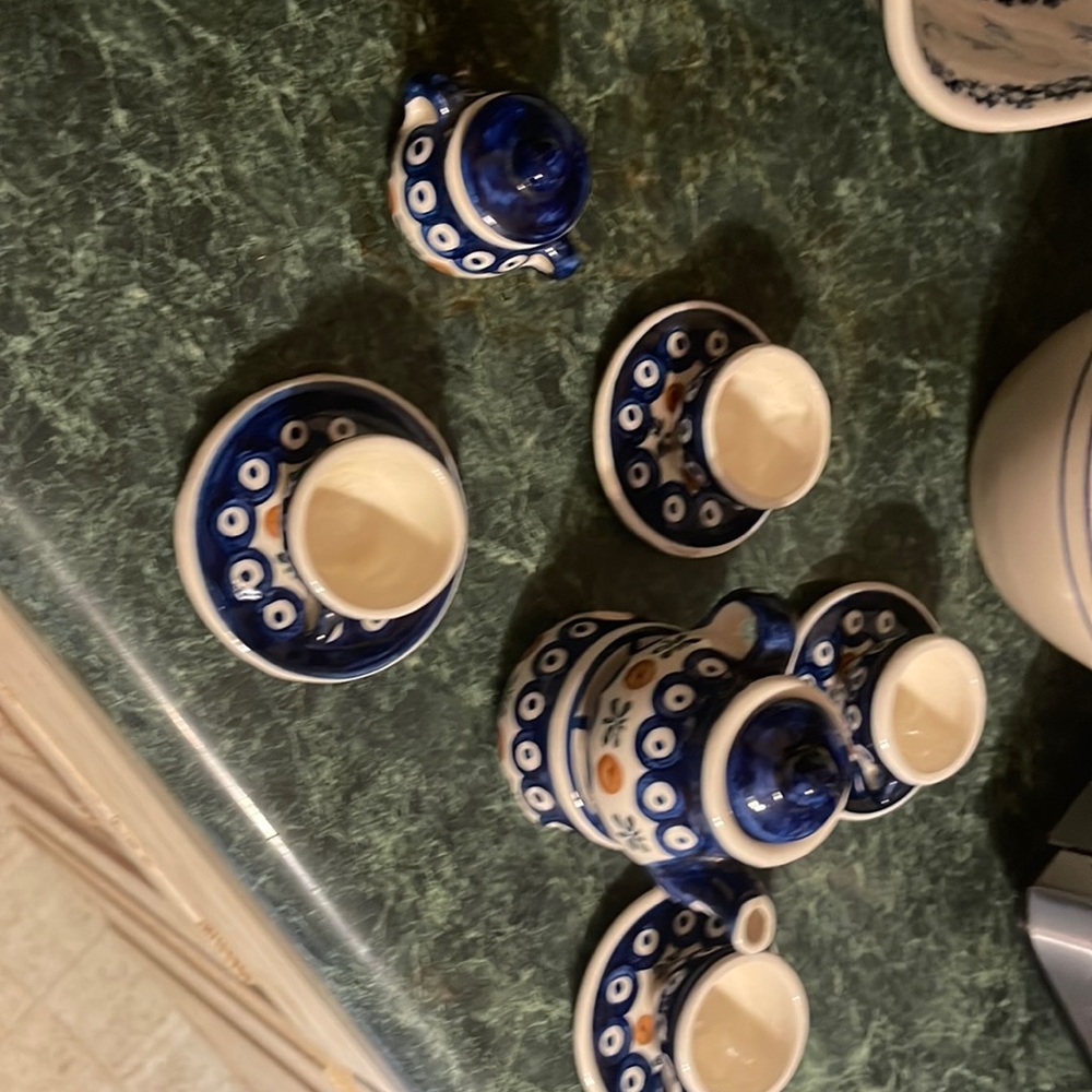 Mini tea set.  Tea light candle keeps tea or coco warm.  Collectible